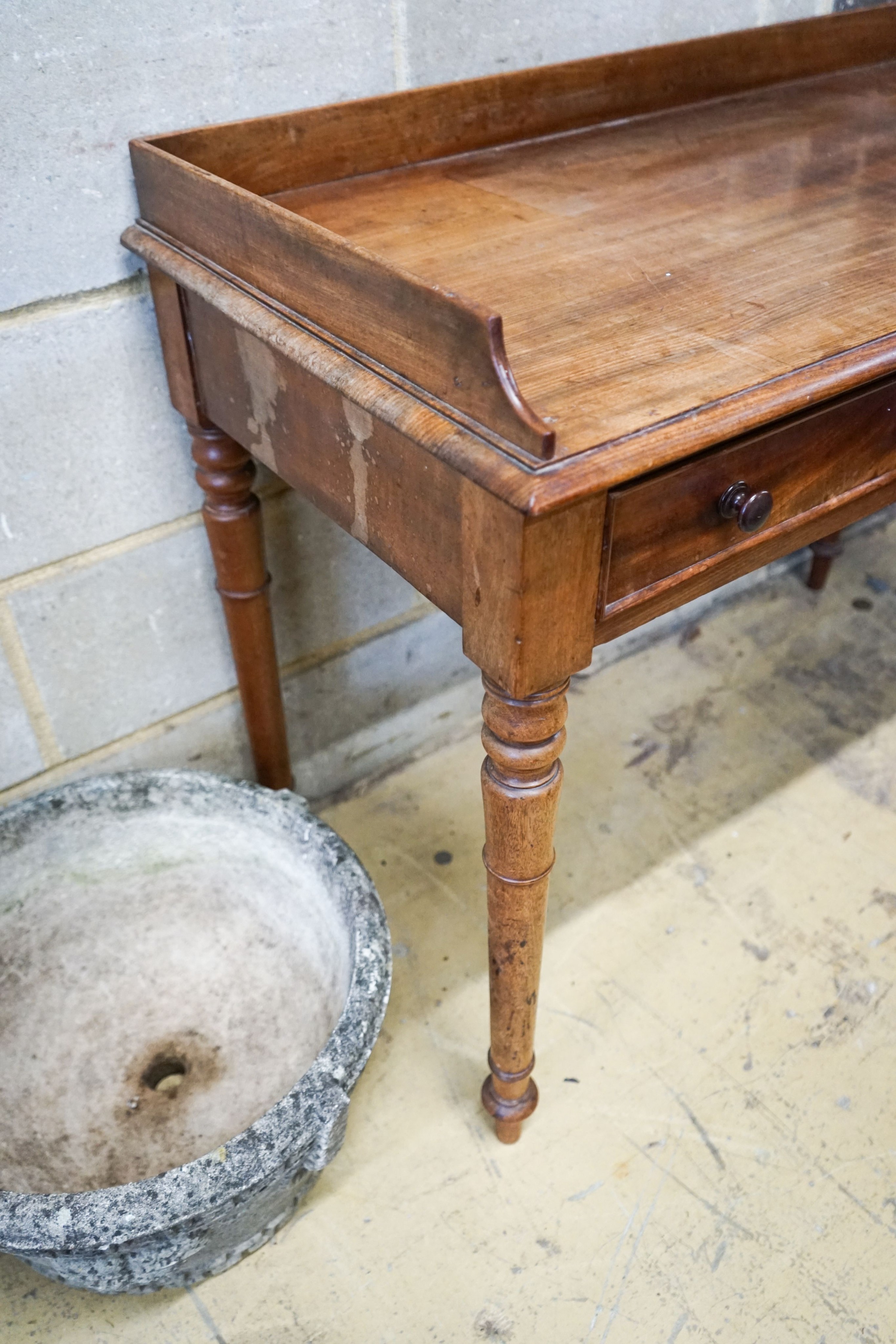 A Victorian mahogany two drawer side table stamped 